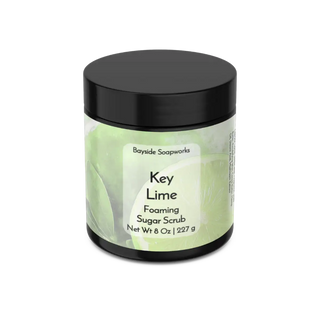 Key Lime Foaming Sugar Scrub jar with black lid on a white background