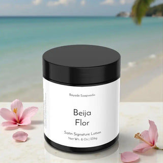 Beija Flor satin signature lotion jar with a beach background