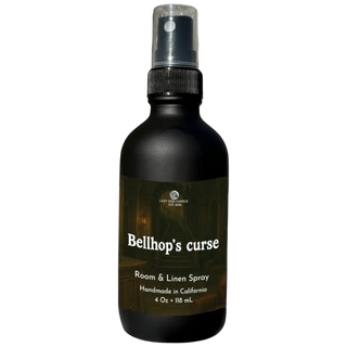 Black spray bottle labeled 'Bellhop's Curse' on a white background
