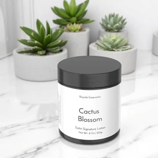 Cactus Blossom lotion jar with succulents in the background