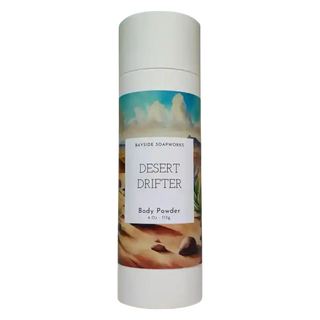 Body powder canister with 'Desert Drifter' label on a white background