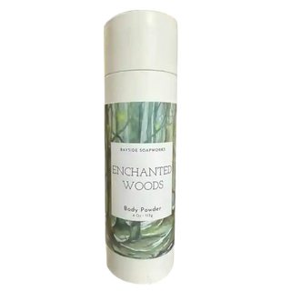 Body powder bottle labeled 'Enchanted Woods' by Bayside Soapworks on a white background