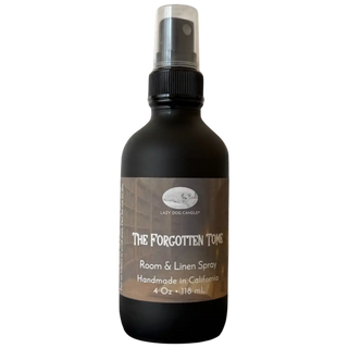 Black room and linen spray bottle labeled 'The Forgotten Tome' on a white background