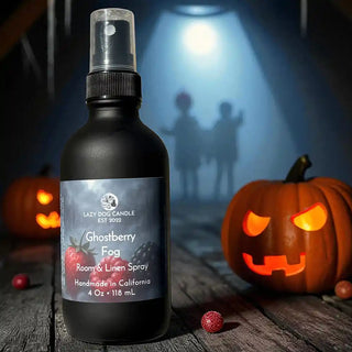 Bottle of Ghostberry Fog room spray with Halloween-themed background