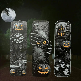 Three Halloween-themed bookmarks with pumpkins, ghosts, and a haunted house design against a dark background.