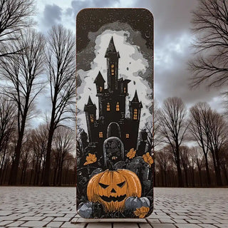 Halloween-themed bookmark with a castle and pumpkin design against a dark sky.