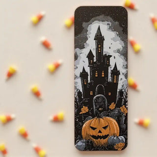 Halloween-themed bookmark with a castle and pumpkin on a beige background with candy corn.