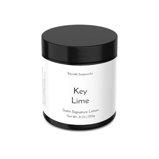 Key Lime satin signature lotion jar with black lid on a white background