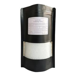 Black packaging of lavender soaking salts with a white label on a white background