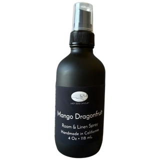 Black room and linen spray bottle labeled 'Mango Dragonfruit' on a white background