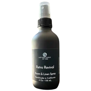 Room and linen spray bottle labeled 'Retro Revival' by Lazy Dog Candle on a white background