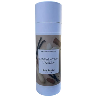 Body powder container with sandalwood and vanilla imagery on a white background