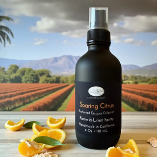 Black room and linen spray bottle with oranges and a scenic background