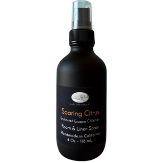 Black room and linen spray bottle labeled 'Soaring Citrus' on a white background