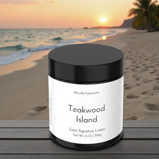 Jar of 'Teakwood Island' satin signature lotion on a beach with sunset background